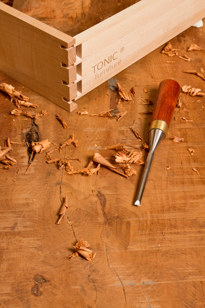 TONIC furniture dovetail detail with chisel in foreground